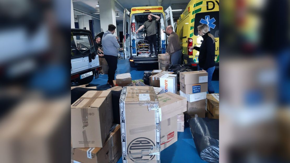 Ukrainian footballer Roman Zozulya and fellow volunteers stuff ambulances to be sent to Ukraine with care packages in Madrid in Spain.