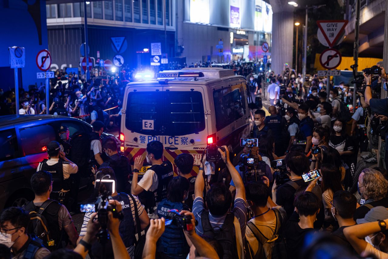 A police van carrying a protester passes by Hong Kong's Victoria Park, the traditional venue of the Tiananmen Square candlelight vigil, in June 2022. Hong Kong police had warned residents that commemorative gatherings would violate the national security law.