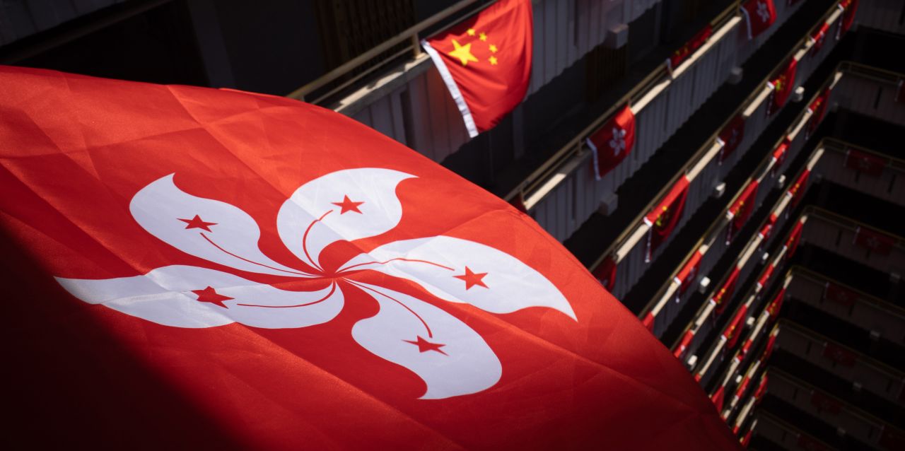 Chinese national and Hong Kong regional flags decorate a public housing building ahead of the city's 25th handover anniversary.