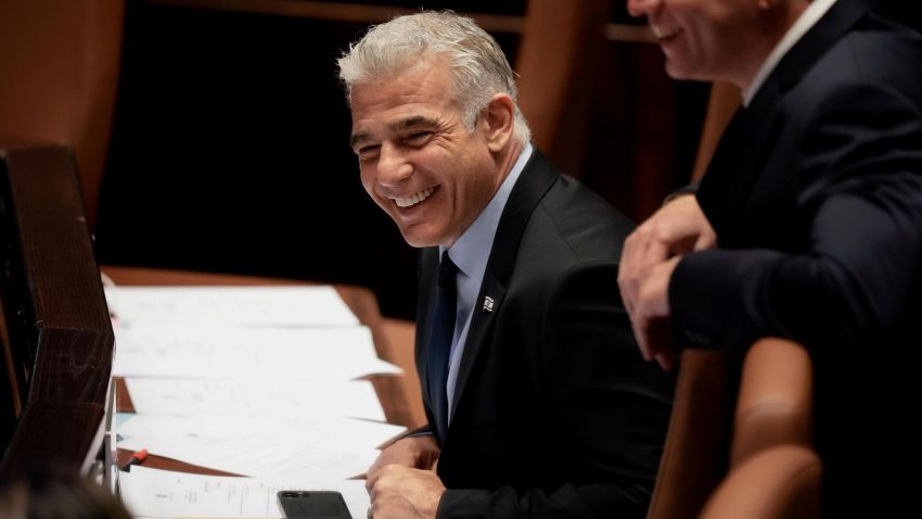 Israeli Foreign Minister Yair Lapid smiles ahead of the vote on a bill to dissolve parliament, at the Knesset, Israel's parliament, in Jerusalem, Thursday, June 30, 2022. Lapid will serve as caretaker prime minister until elections this fall. It would be Israel's fifth election in under four years. (AP Photo/Ariel Schalit)