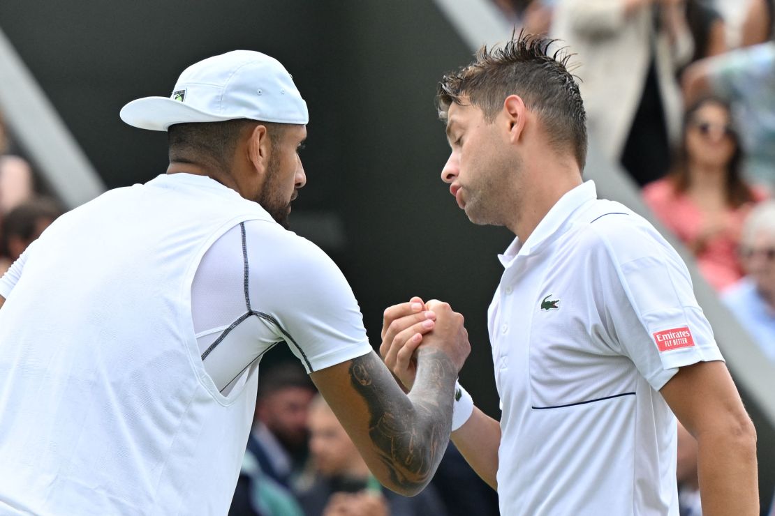 Kyrgios (left) and Krajinovic (right) shake hands after their second-round match at Wimbledon.