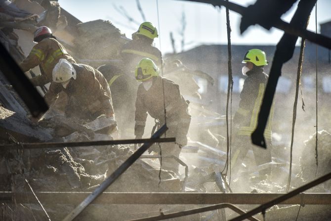 Firefighters clear rubble at the Amstor shopping mall in Kremenchuk, Poltava Oblast, Ukraine, on June 28.