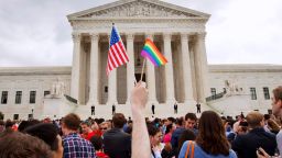 A crowd celebrates outside of the Supreme Court in Washington after the court declared that same-sex couples have a right to marry anywhere in the U.S on June 26 2015. On Friday, Aug. 16, 2019, the Justice Department brief filed telling the Supreme Court that federal law allows firing workers for being transgender. The brief is related to a group of three cases that the high court will hear in its upcoming term related to LGBTQ discrimination in the workplace. (AP Photo/Jacquelyn Martin, File)