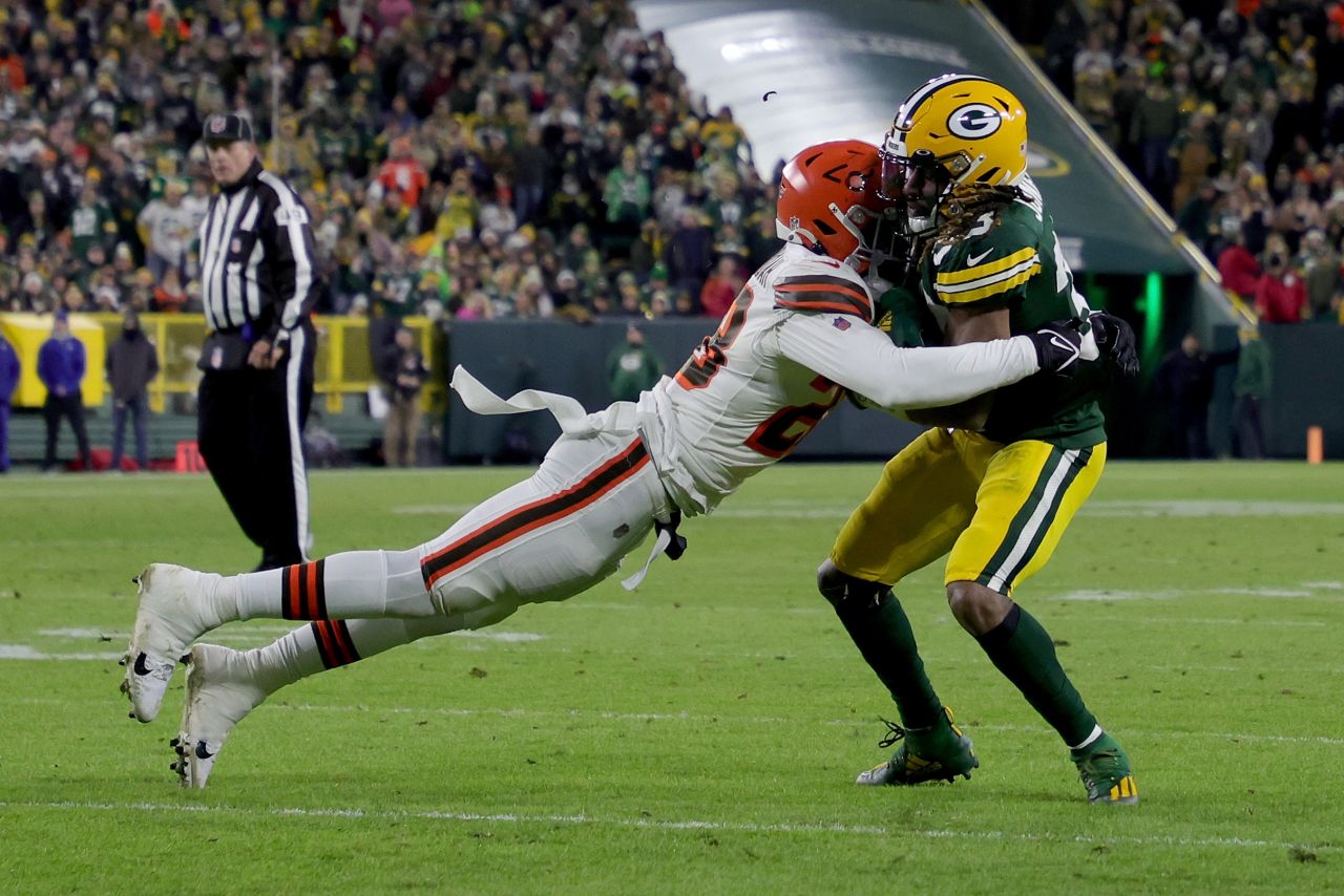 <strong>Jeremiah Owusu-Koramoah</strong> -- Among relative newcomers to the NFL is Owusu-Koramoah, of Ghanaian descent on his father's side, pictured here (left, in the white jersey) making a tackle for his Cleveland Browns against the Green Bay Packers in 2021.