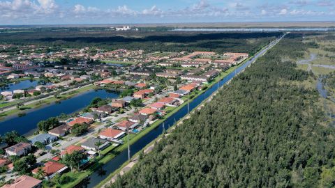 Urban sprawl is nestled next to protected wetlands on the fringes of Everglades National Park.