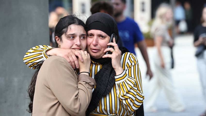 People react outside Field's shopping centre, after Danish police said they received reports of shooting, in Copenhagen, Denmark, July 3, 2022.