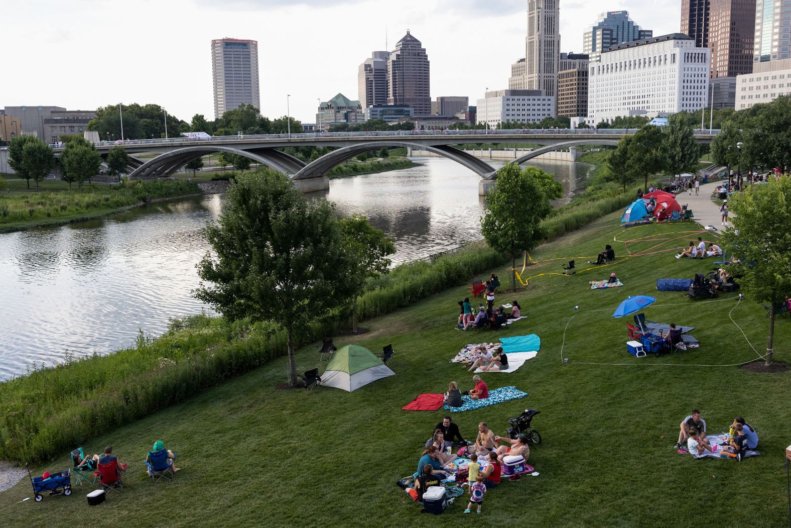 People set up blankets, foldable chairs and tents in Columbus' Bicentennial Park.