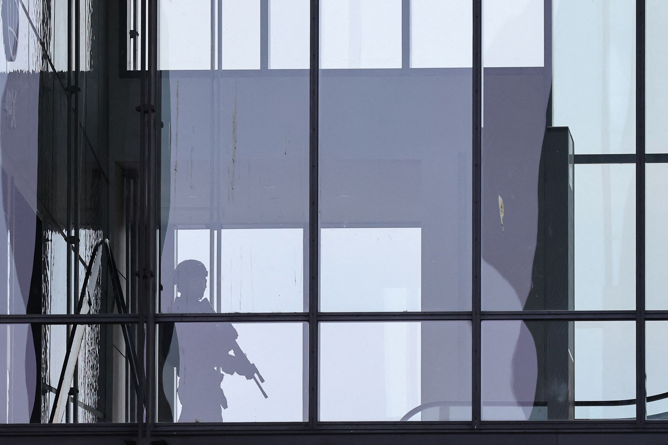 An armed police officer responds to reports of a shooting at the Field's shopping center in Copenhagen, Denmark, on July 3.