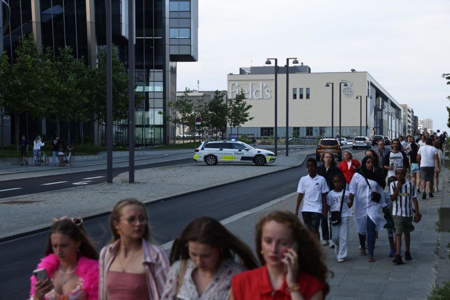 People evacuate the Field's shopping center in Copenhagen, Denmark, after a shooting on July 3. 