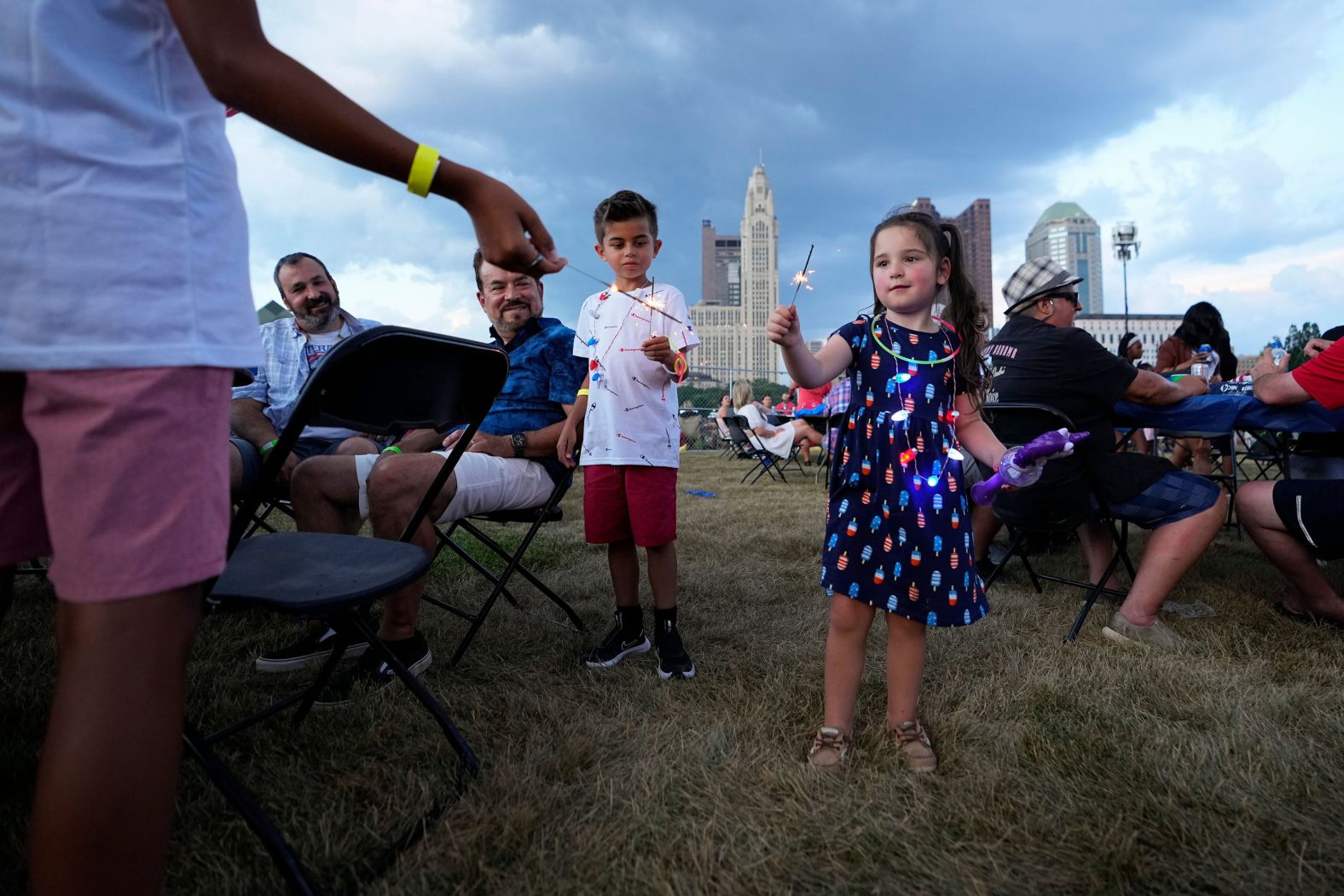 Children light sparklers during a fireworks show in Columbus, Ohio, on Friday.