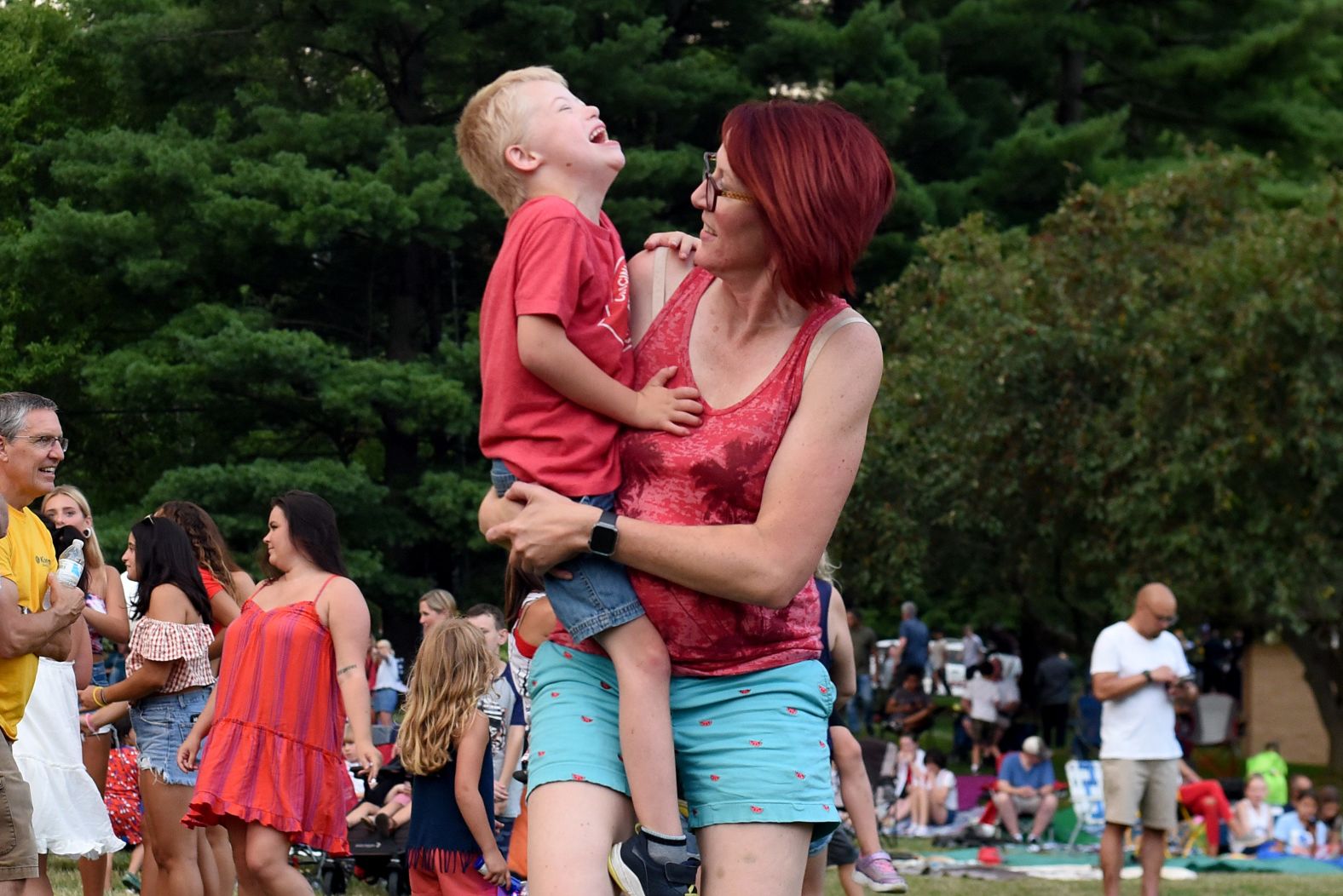 Megan Weaver and her 5-year-old son, Luke, dance to the music of McGuffey Lane before the fireworks in Granville, Ohio, on Friday.