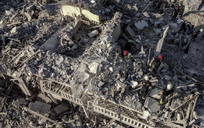 An aerial view of rescue workers after a <a href="index.php?page=&url=https%3A%2F%2Fedition.cnn.com%2F2022%2F07%2F01%2Feurope%2Fodesa-russian-strikes-residential-building-intl%2Findex.html" target="_blank">missile attack in the Serhiivka district of Odesa</a>, Ukraine, on July 1.