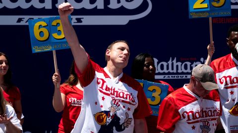 Joey Chestnut reacts after scarfing more hot dogs than anyone else Monday.