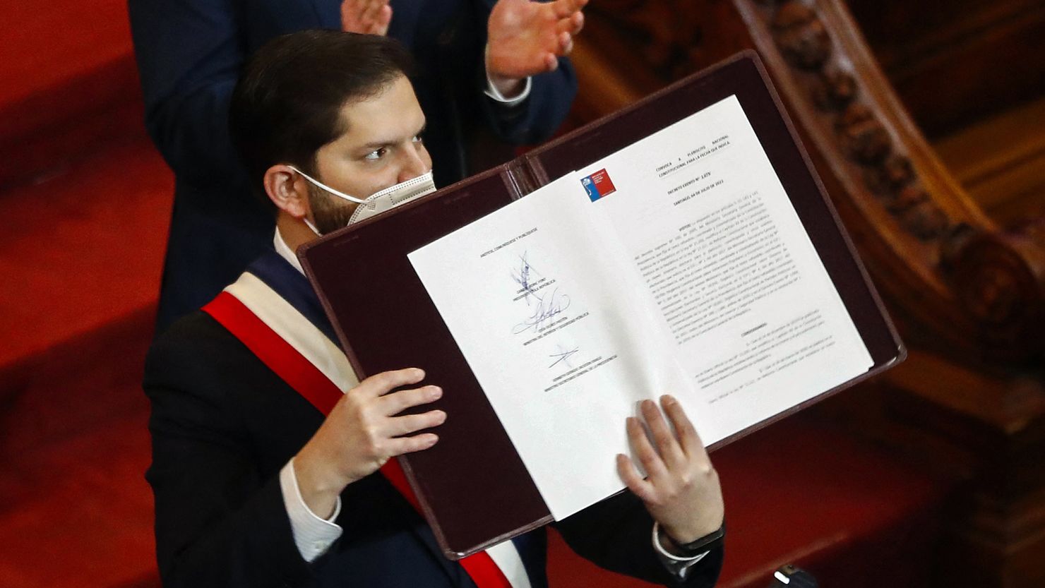 Chilean President Gabriel Boric holds the final draft of the constitutional proposal on July 4.