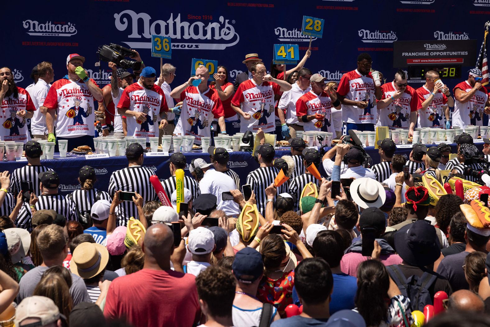 Competitive eaters take part in the annual Nathan's Hot Dog Eating Contest in New York on Monday. <a href="https://www.cnn.com/2022/07/04/us/nathans-hot-dog-contest-winner/index.html" target="_blank">Joey Chestnut devoured 63 hot dogs and buns in 10 minutes</a> to win the event for the 15th time in 16 years.