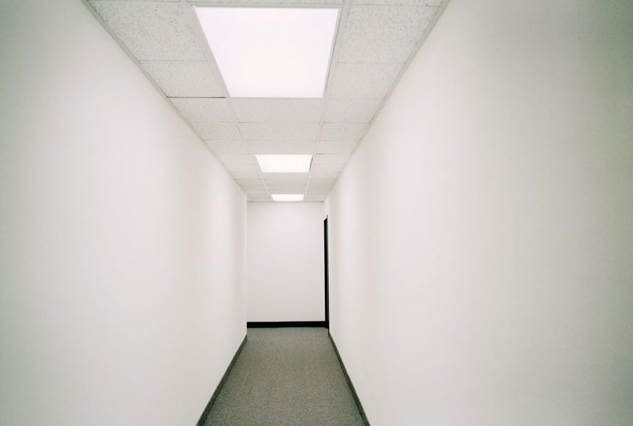 The empty hallway of a law firm.