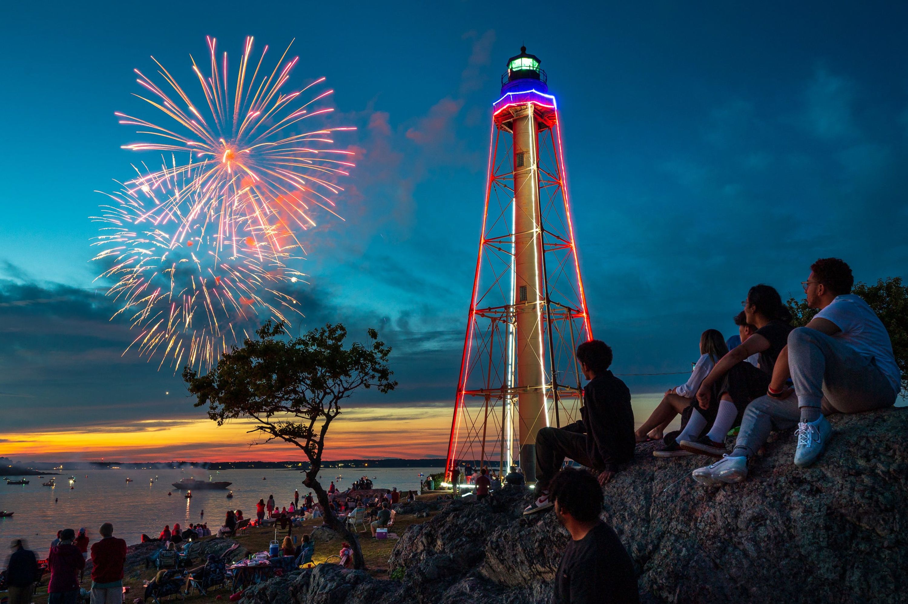 Community members gather at Chandler Hovey Park to watch the Fourth of July fireworks display Marblehead, Massachusetts, Monday.