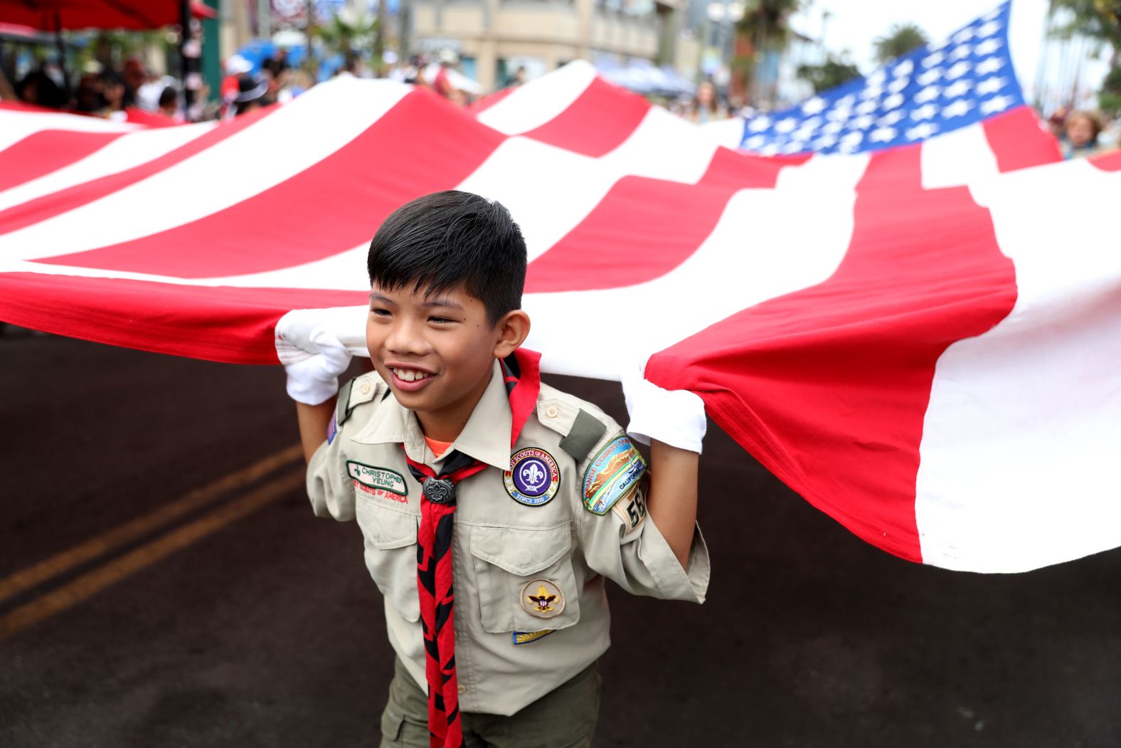 Christopher Yeung, of Orange County Boy Scout Troop 567, at the Huntington Beach Fourth of July Parade in California Monday.