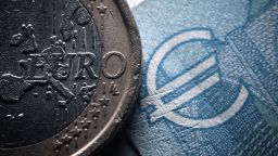 22 June 2022, Baden-Wuerttemberg, Rottweil: The lettering Euro can be seen on a 1-Euro coin next to a 20-Euro Schin in an office. Photo: Silas Stein/dpa (Photo by Silas Stein/picture alliance via Getty Images)