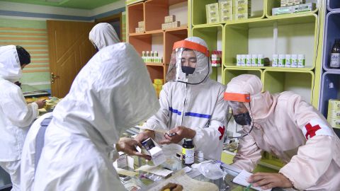 Members of the North Korean army supply medicines to residents at a pharmacy in Pyongyang, amid growing fears over the spread of the coronavirus, on May 18.