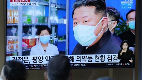 People in Seoul, South Korea, watch a TV news report about North Korean leader Kim Jong Un and his country's Covid outbreak in May.