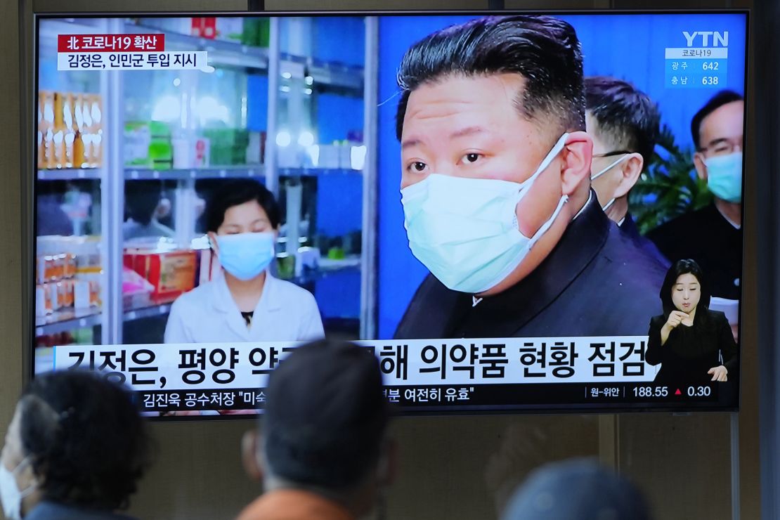 People in Seoul, South Korea, watch a TV news report about North Korean leader Kim Jong Un and his country's Covid outbreak on May 16, 2022. 