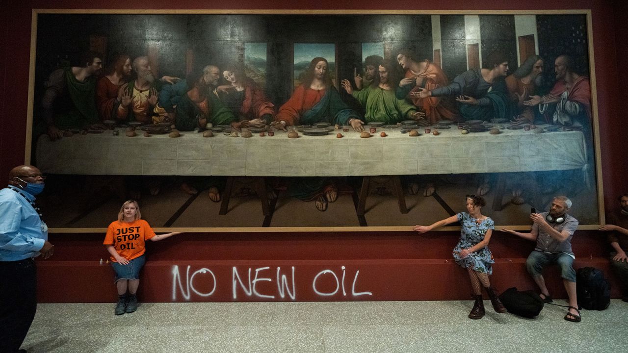 Activists glue themselves to copy of Leonardo's 'The Last Supper ...