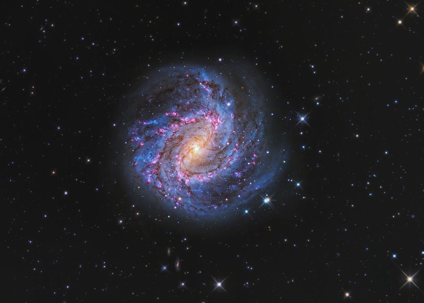 Peter Ward combined a deep set of H-alpha exposures with color data to bring out the ruby shades of the Southern Pinwheel Galaxy from New South Wales, Australia. 