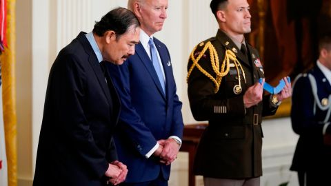 President Joe Biden stands with Spc. Dennis Fujii before awarding the Medal of Honor to Fujii for his actions on Feb. 18-22 1971, during the Vietnam War.