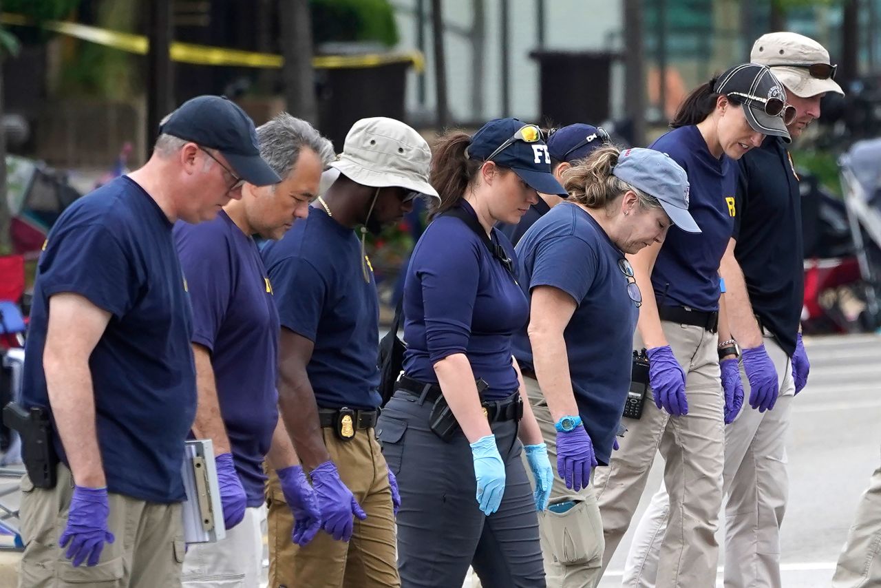 Members of the FBI evidence response team work at the scene a day after the shooting in downtown Highland Park on July 5. 