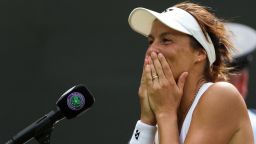 Germany's Tatjana Maria reacts during the post-match interview after winning against Germany's Jule Niemeier during their women's singles quarter final tennis match on the ninth day of the 2022 Wimbledon Championships at The All England Tennis Club in Wimbledon, southwest London, on July 5, 2022. - RESTRICTED TO EDITORIAL USE (Photo by Adrian DENNIS / AFP) / RESTRICTED TO EDITORIAL USE (Photo by ADRIAN DENNIS/AFP via Getty Images)
