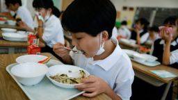 A student eats school lunch at Senju Aoba Junior High School in Tokyo, Japan June 29, 2022.