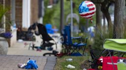 Chairs, bicycles, strollers and balloons were left behind at the scene of a mass shooting on the Fourth of July parade route Monday, July 4, 2022, along Central Avenue in Highland Park. (Brian Cassella/Chicago Tribune/Tribune News Service via Getty Images)