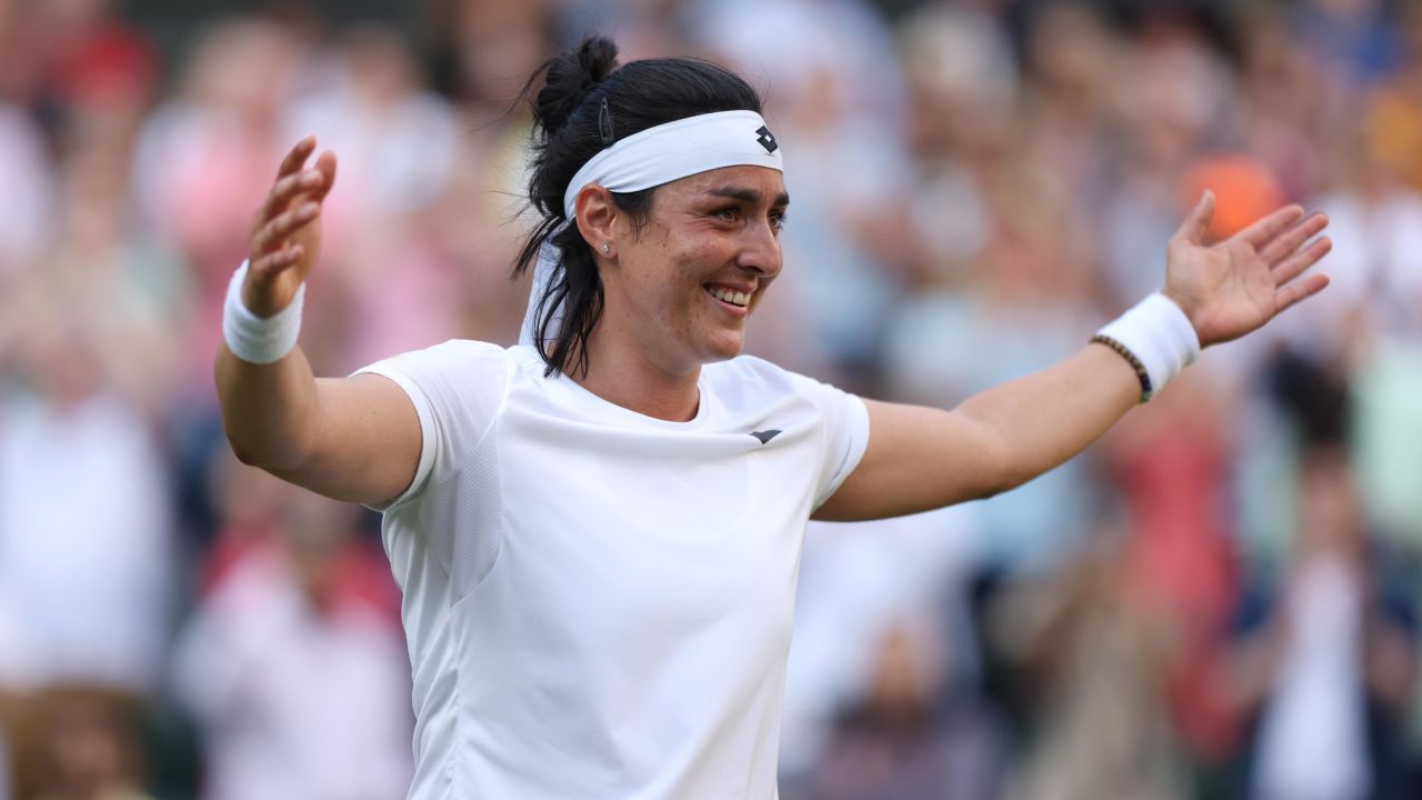 Ons Jabeur celebrates making history after beating Marie Bouzková in their women's quarterfinal at Wimbledon.