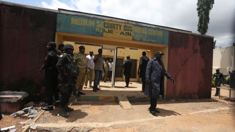 Security officials stand outside Kuje Medium Security pison in Abuja, Nigeria on July 6, 2022, after suspected Boko Haram gunmen attacked the Kuje Medium Prison. - Suspected Boko Haram gunmen used explosives to blast their way into a Nigerian prison near the capital, freeing hundreds of inmates in a raid to break out jailed jihadists, the government said on Monday.
The brazen attack on the outskirts of Abuja came hours after an ambush on a presidential security convoy in the northwest, in a fresh illustration of Nigeria's security crisis.