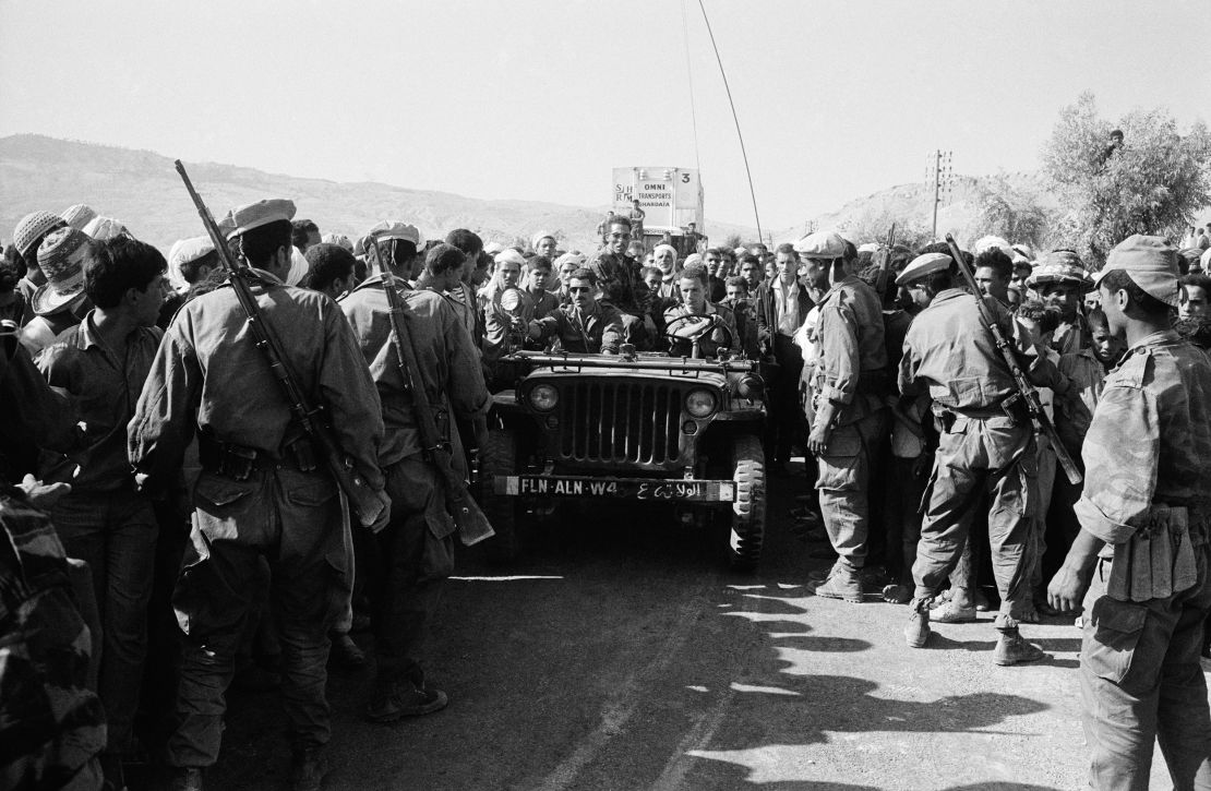 Troops from the National Liberation Army, the armed wing of the National Liberation Front, marching in the district of Medea in Algiers, Algeria, in September 1962.