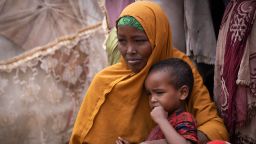 Noorta Ali Humey says hunger drove her family to Mogadishu. By the time she arrived it was too late for three of her children. They are now buried in the camp, just 500 yards away.