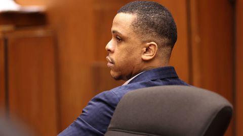 Eric Holder listens during opening statements in his trial on June 15.
