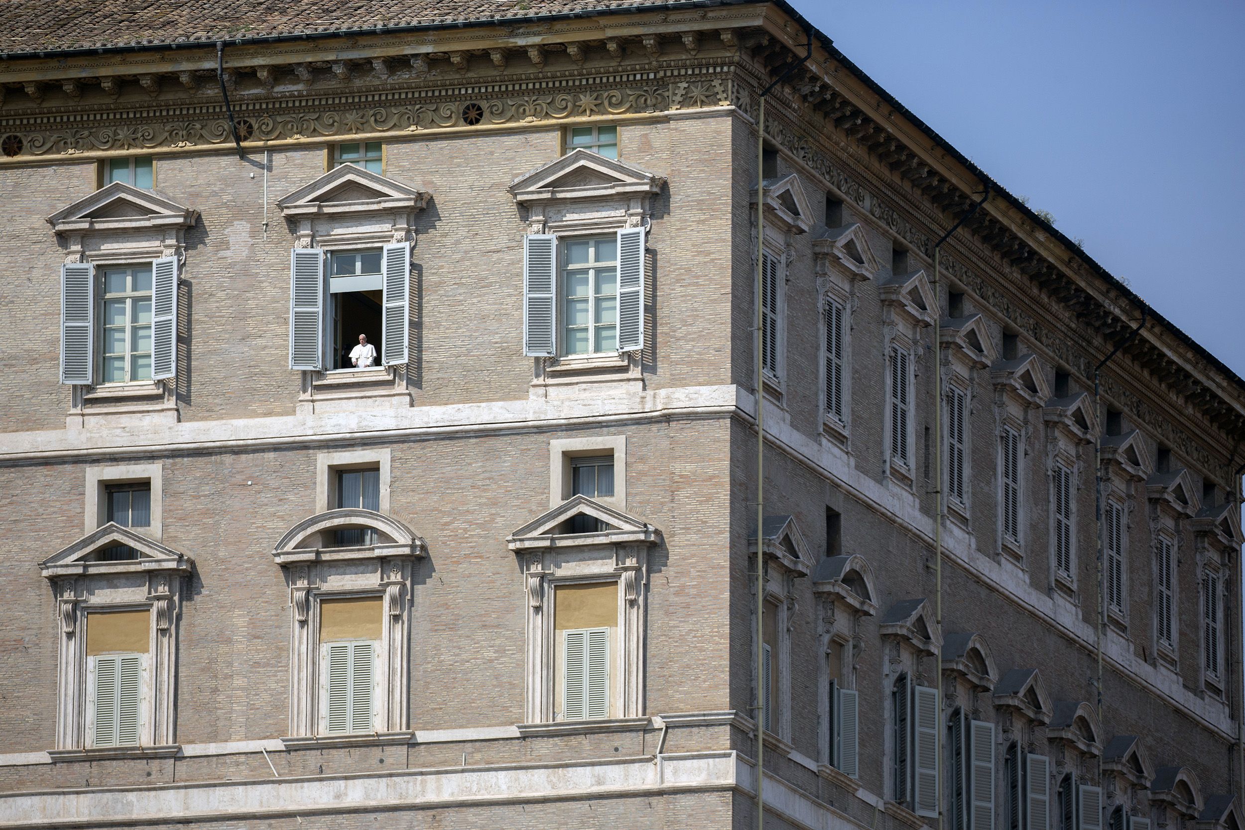 The Pope delivers his weekly blessing from the window of his private library in March 2020.