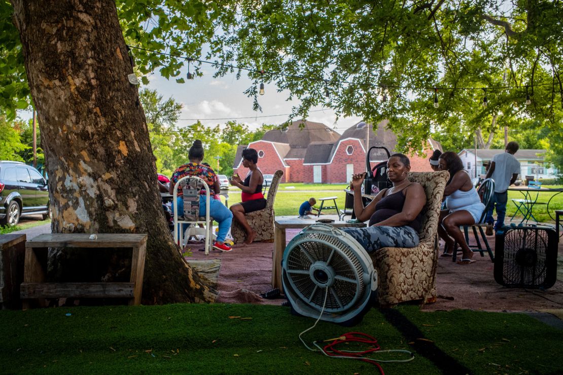 The Johnson family cools off outside their Houston home during a particularly intense early season heat wave in June.