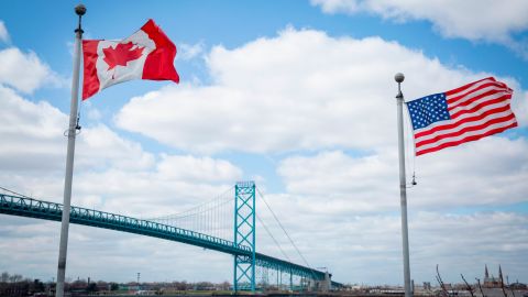 The Ambassador Bridge spans the Detroit River to connect Windsor, Ontario, to Detroit, Michigan. With Covid-19 restrictions lifted, land travel between the two North American neighbors is back. But what does Canada think about the mass shootings in the US?