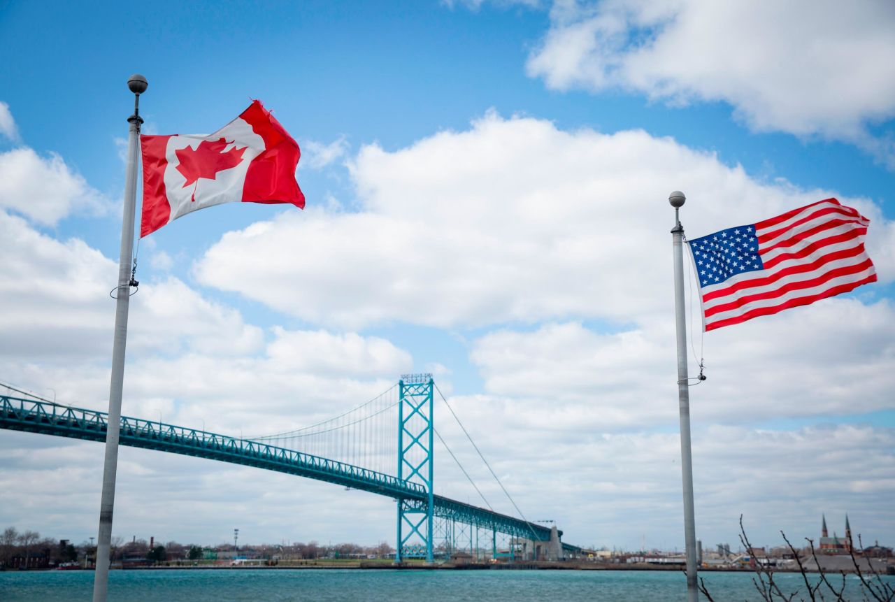 The Ambassador Bridge spans the Detroit River to connect Windsor, Ontario, to Detroit, Michigan. With Covid-19 restrictions lifted, land travel between the two North American neighbors is back. But what does Canada think about the mass shootings in the US?