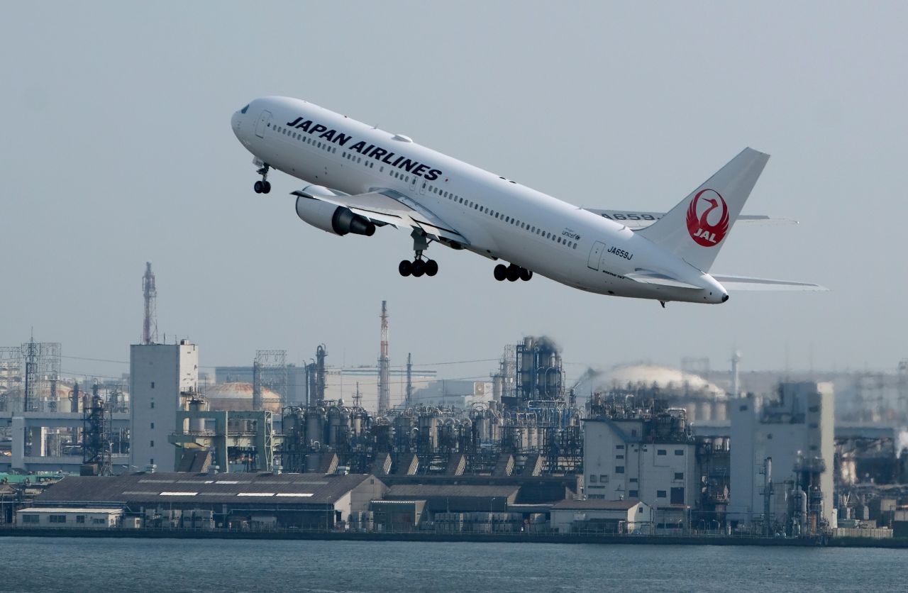 A Japan Airlines passenger jet takes off from Haneda Airport in Tokyo. The Japanese government gives its citizens explicit instructions on what to do if caught in an active shooter incident in the United States.