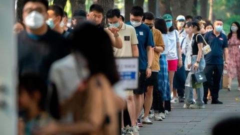 People stand in line at a coronavirus testing site in Beijing on July 2.