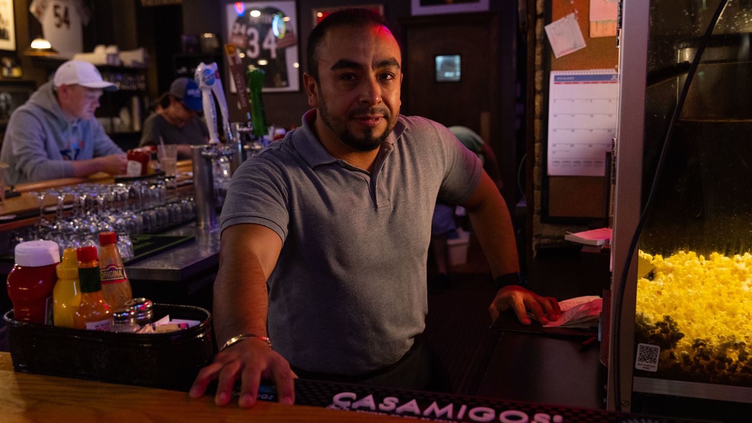 Israel Velez works the bar at Norton's Restaurant the day after learning his friend and longtime regular Stephen Straus was killed.