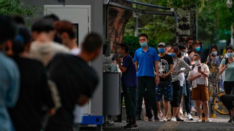 People stand in line at a coronavirus testing site in Beijing on July 4.