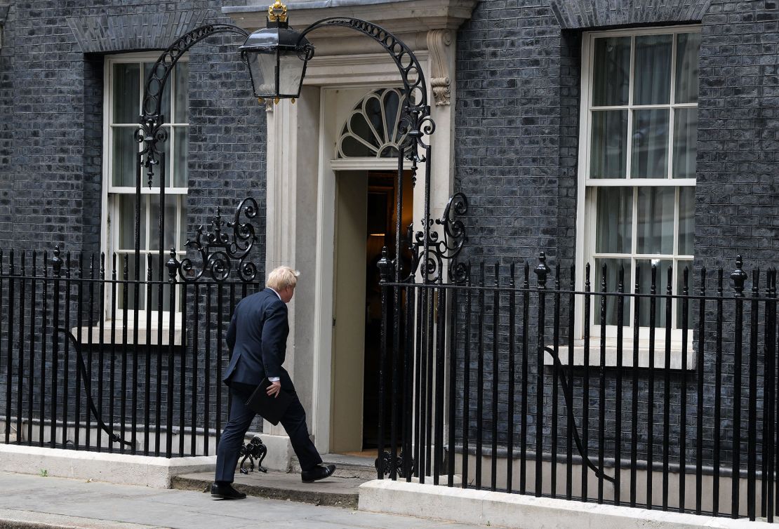 Johnson walks back into 10 Downing Street on July 7, 2022 after making his resignation statement. 