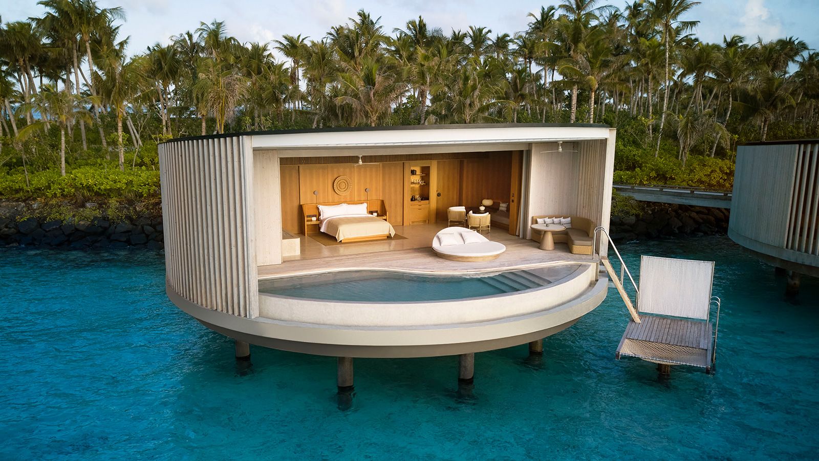 <strong>The Ritz-Carlton Maldives, Fari Islands: </strong>The majority of the 100 villas at this stunning new luxury resort are over water. Channeling the motion of the ocean, each is uniquely circular in design and outfitted with distinct, vertical wooden slats made from sustainable timber. 