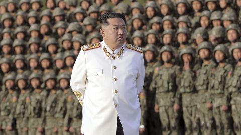 In this photo provided by the North Korean government, North Korean leader Kim Jong Un attends a photo session with officers and soldiers, April 27, 2022.
