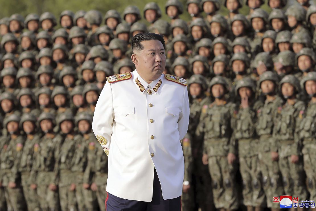 In this photo provided by the North Korean government, North Korean leader Kim Jong Un attends a photo session with officers and soldiers, April 27, 2022.